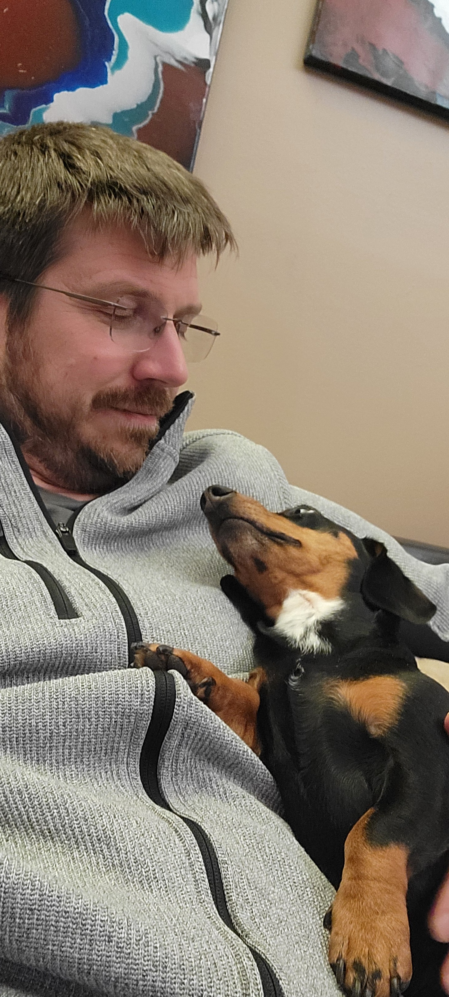 Brian stares lovingly at his Dog